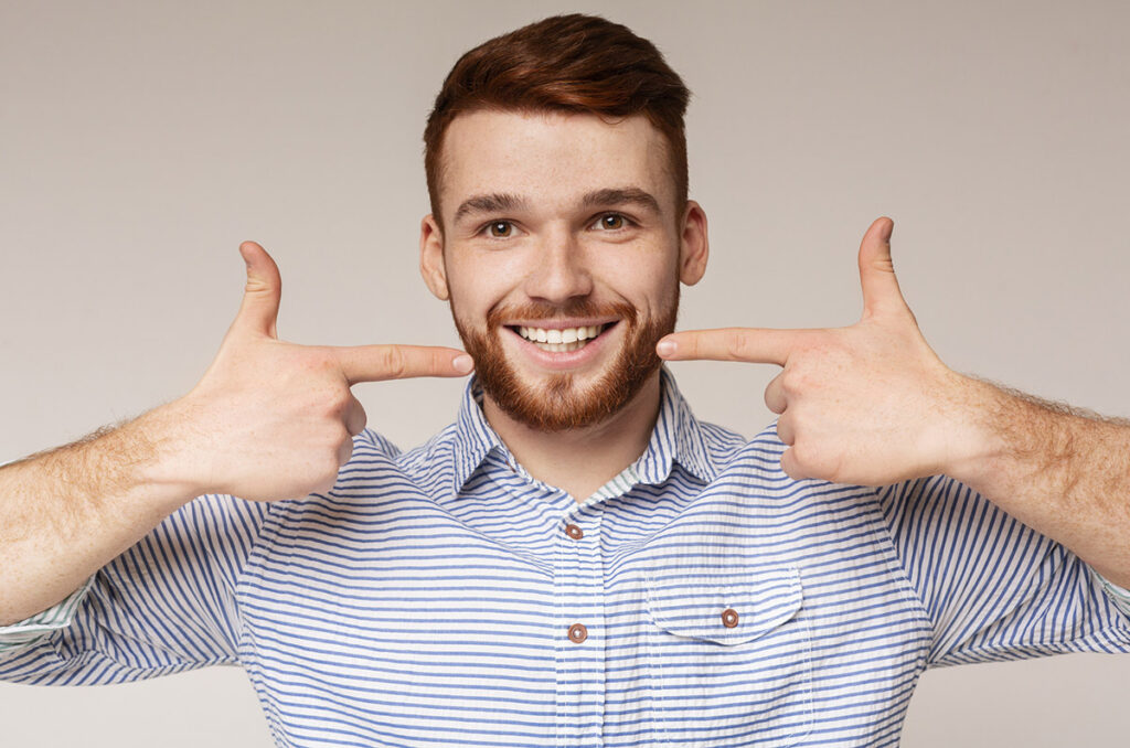 A young man showing off his beautiful smile.