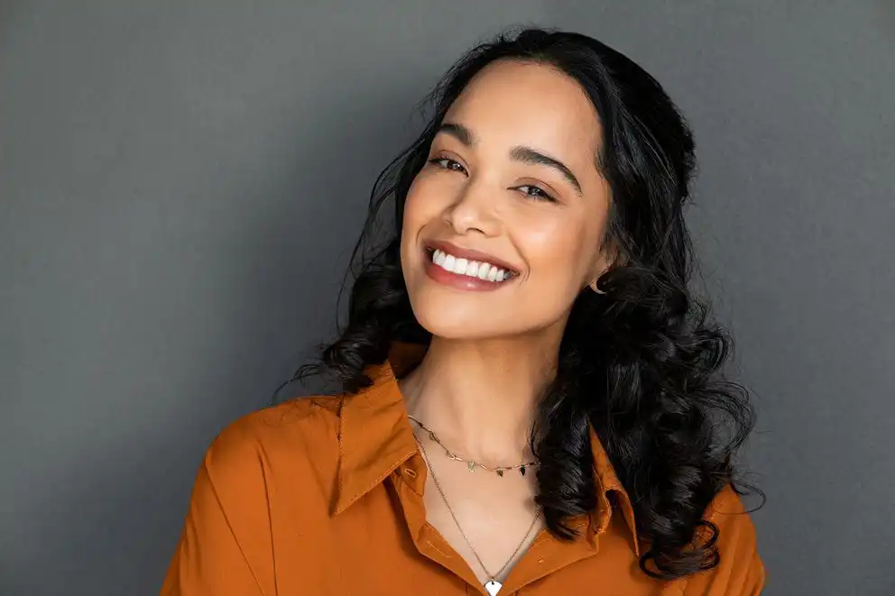 Women smiling showing her healthy white teeth