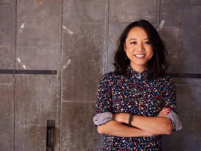 Portrait Of Female Designer Standing In Modern Office.
