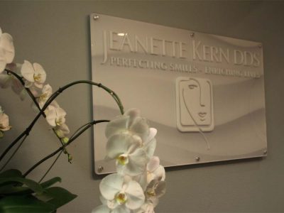 Jeanette Kern dentistry practice front desk sign - Your First Visit